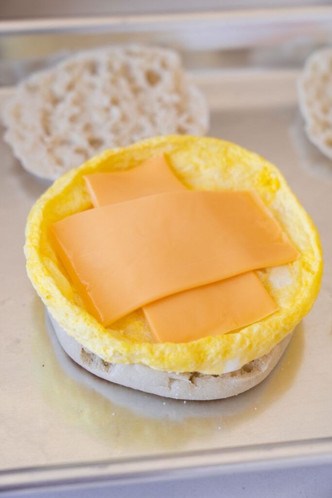 slice of cheese on top of egg.