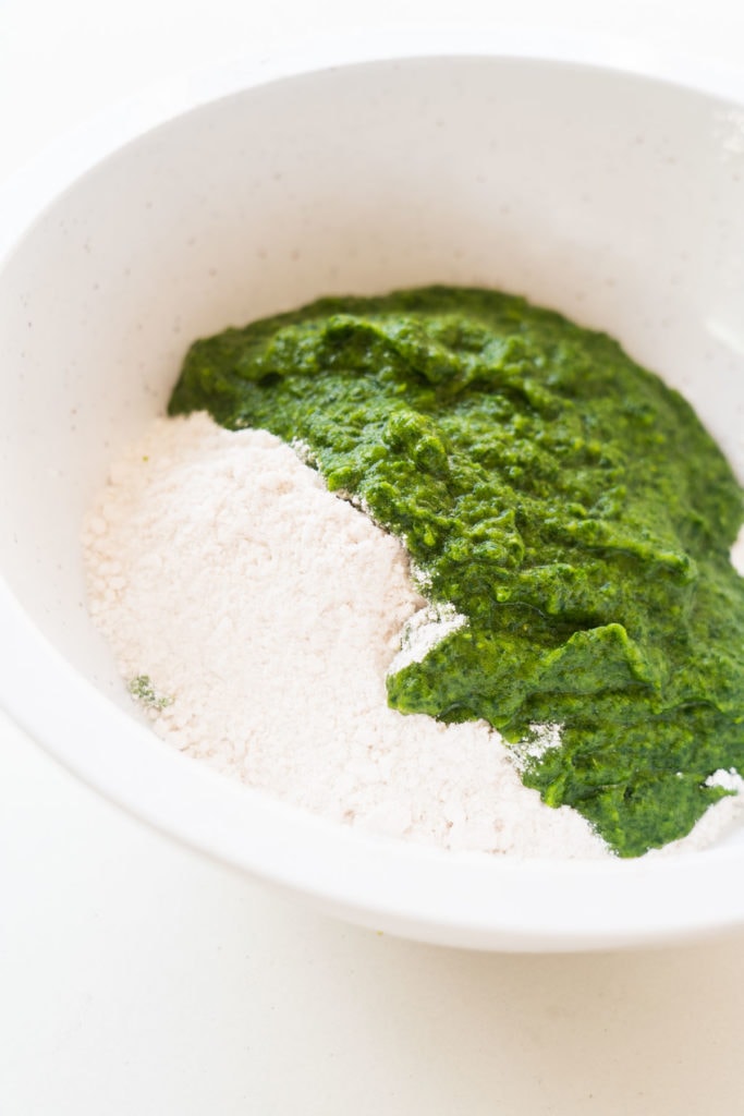 Spinach and flour in bowl. 