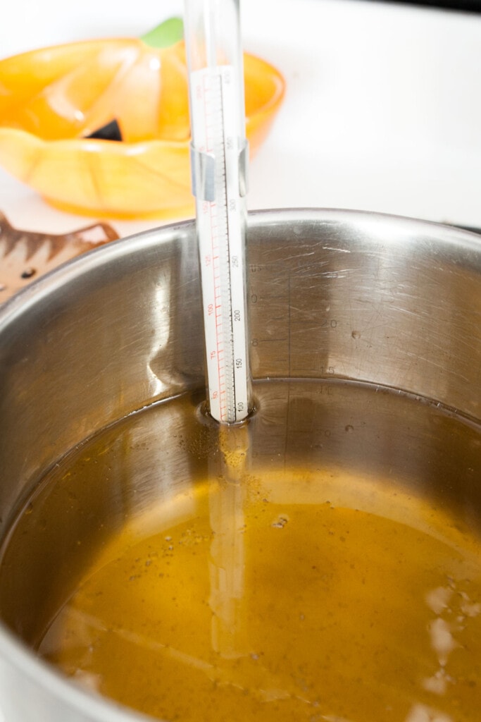 thermometer in large pot of vegetable oil.