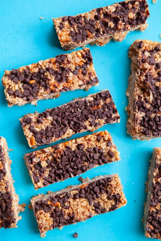granola bars with pretzels and chocolate chips on blue background.