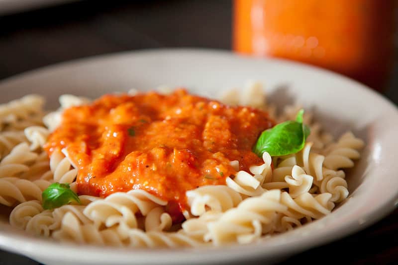 plate of pasta with cherry tomato sauce on it