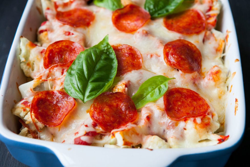 This pizza casserole with cauliflower is a one dish meal made with pepperoni, cauliflower and plenty of cheese, all mixed with pizza sauce. An easy dinner that's family friendly and quick to make! 