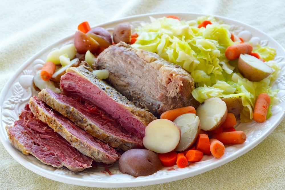 DELICIOUS CROCK POT Corned Beef Brisket with Vegetables recipe!  This slow cooker recipe cooks a 4 pound corned beef brisket with cabbage, carrots, potatoes and onion to create a amazing dinner! Use the leftovers the next day for the best BBQ sandwiches!