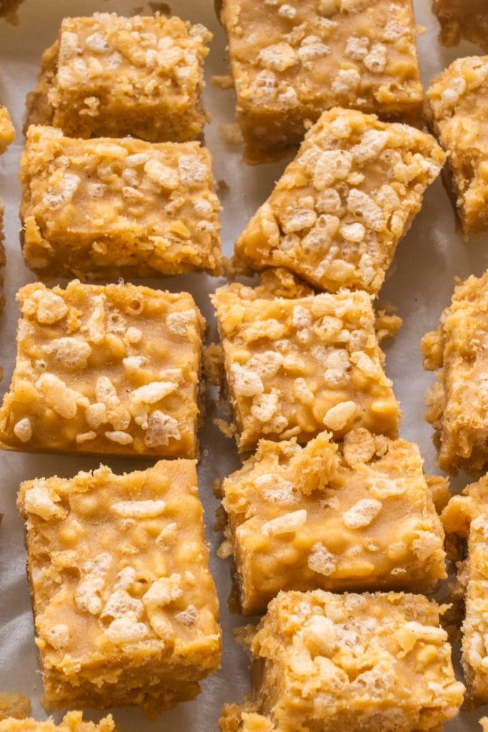 pieces of peanut butter fudge on wax paper.