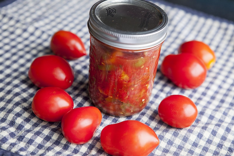 The BEST Stewed Tomatoes Ever recipe!  This easy to make recipe simmers tomatoes for 30 minutes to make homemade stewed tomatoes that can be served as a dinner side dish or can be canned.  This how to make recipe shows you how easy they are to make! Find out why everyone considers them THE BEST!   We always use this as a canning recipe for our Summer garden tomatoes! 