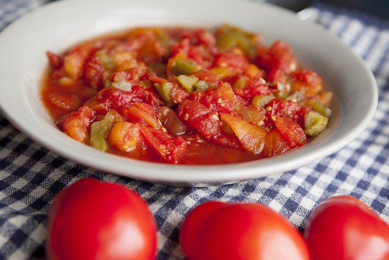 The BEST Stewed Tomatoes Ever recipe!  This easy to make recipe simmers tomatoes for 30 minutes to make homemade stewed tomatoes that can be served as a dinner side dish or can be canned.  This how to make recipe shows you how easy they are to make! Find out why everyone considers them THE BEST!   We always use this as a canning recipe for our Summer garden tomatoes! 