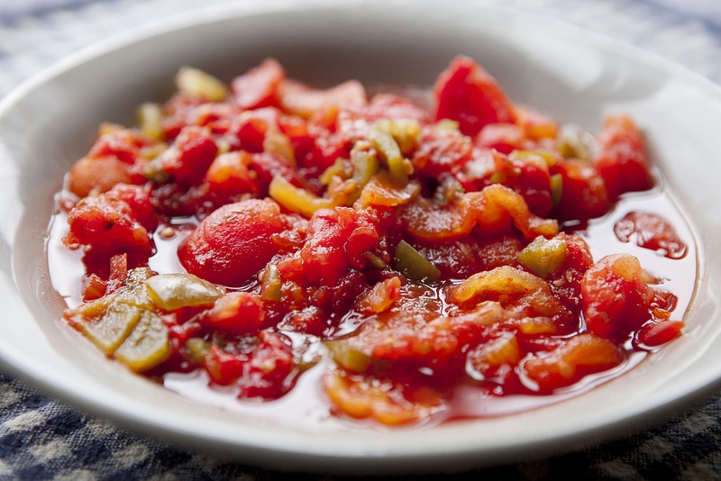 The BEST Stewed Tomatoes Ever recipe!  This easy to make recipe simmers tomatoes for 30 minutes to make homemade stewed tomatoes that can be served as a dinner side dish or can be canned.  This how to make recipe shows you how easy they are to make! Find out why everyone considers them THE BEST!   We always use this as a canning recipe for our Summer garden tomatoes! 