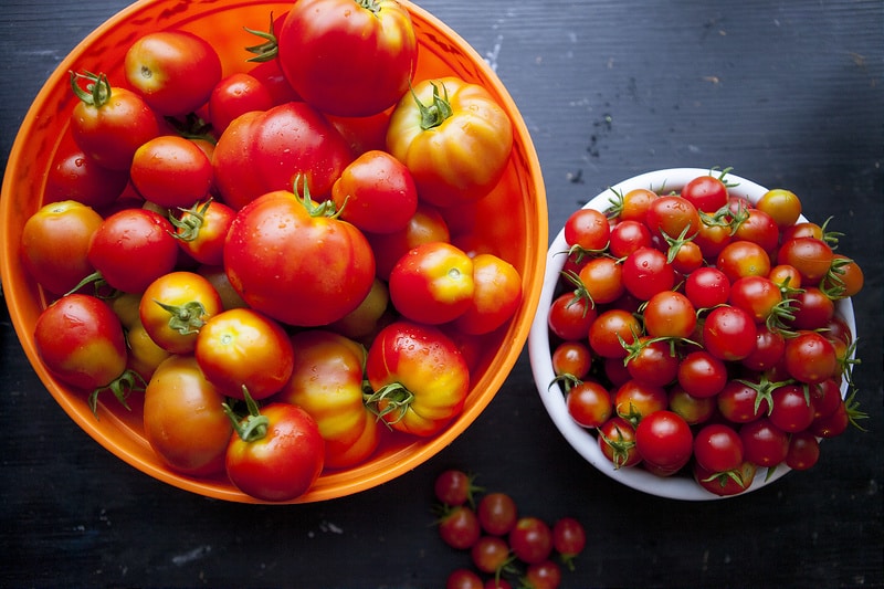 The BEST Stewed Tomatoes Ever recipe!  This easy to make recipe simmers tomatoes for 30 minutes to make homemade stewed tomatoes that can be served as a dinner side dish or can be canned.  This how to make recipe shows you how easy they are to make! Find out why everyone considers them THE BEST!   We always use this as a canning recipe for our Summer garden tomatoes! 