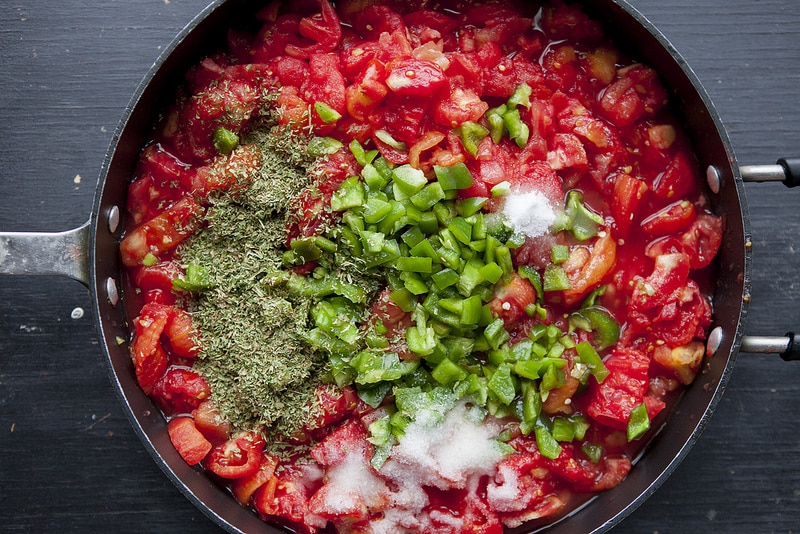 The BEST Stewed Tomatoes Ever recipe!  This easy to make recipe simmers tomatoes for 30 minutes to make homemade stewed tomatoes that can be served as a dinner side dish or can be canned.  This how to make recipe shows you how easy they are to make! Find out why everyone considers them THE BEST!   We always use this as a canning recipe for our Summer garden tomatoes! 