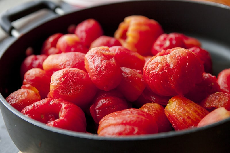 The BEST Stewed Tomatoes Ever recipe!  This easy to make recipe simmers tomatoes for 30 minutes to make homemade stewed tomatoes that can be served as a dinner side dish or can be canned.  This how to make recipe shows you how easy they are to make! Find out why everyone considers them THE BEST!   We always use this as a canning recipe for our Summer garden tomatoes! 