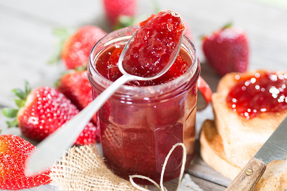 Homemade 15 MINUTE Strawberry Peach Jam recipe that makes a small batch 8 oz jar without pectin! This healthy, easy recipe is a low sugar jam made with honey that makes a perfect jam for toast, dessert and more. I love canning this recipe too!