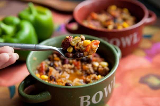 EASY Slow Cooker Pumpkin Chili is packed full of pumpkin, ground turkey, beans, vegetables and Mexican spices. This healthy, hearty chili is perfect for chilly fall and winter nights. Serve this pumpkin chili with cornbread or tortilla chips and your favorite toppings. And be sure to keep this recipe in mind for a football watch party, game night, or office potluck!