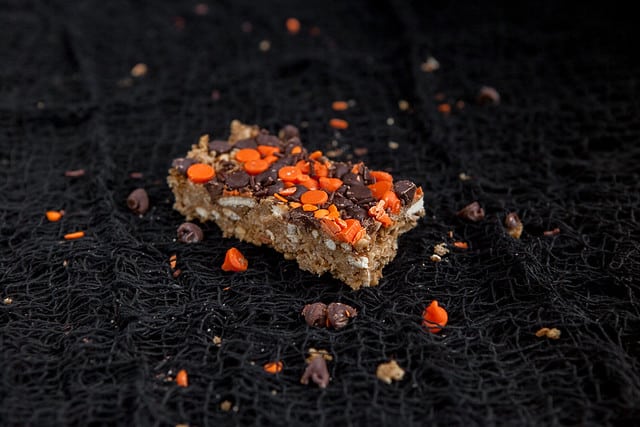 Halloween Decorated Peanut Butter Chocolate Chip Pretzel Granola Bars! These are great for snacks, breakfast and Halloween parties! Use black and orange chocolate chip morsels to make them festive looking!