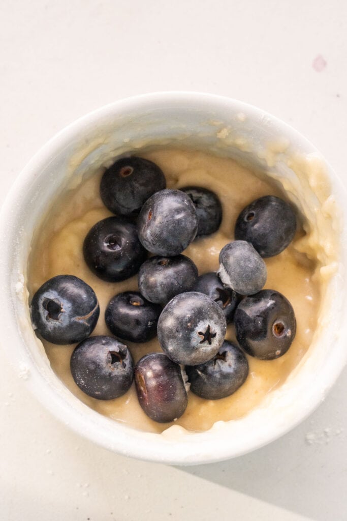 batter with fresh blueberries in small bowl.