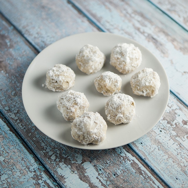 The BEST Powdered Sugar SNOWBALL Cookies!  This is my favorite Christmas cookie recipe! These Russian Tea Cake Cookies are so easy to make! They're made with pecans and then rolled in powdered sugar after baking! I make a few batches to hand out for gifts around the holidays - everyone always love them! 