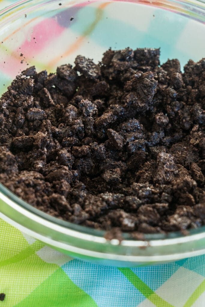 oreo cookies and butter mixed in bowl.