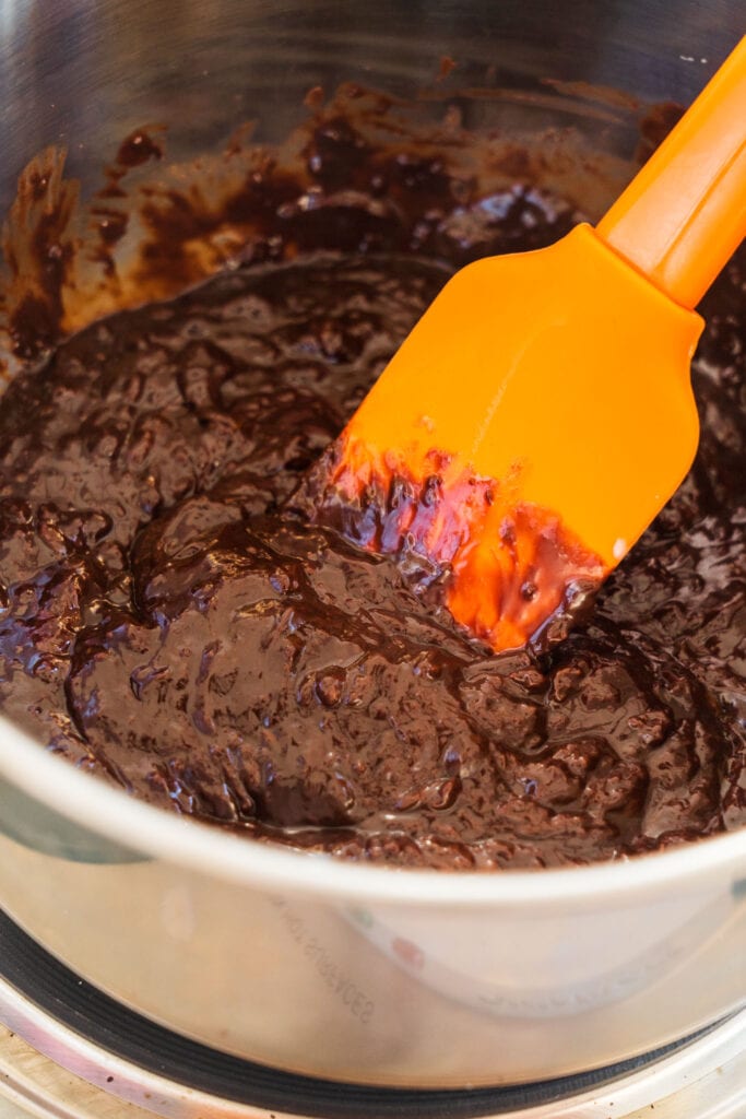 spatula mixing chocolate sauce.