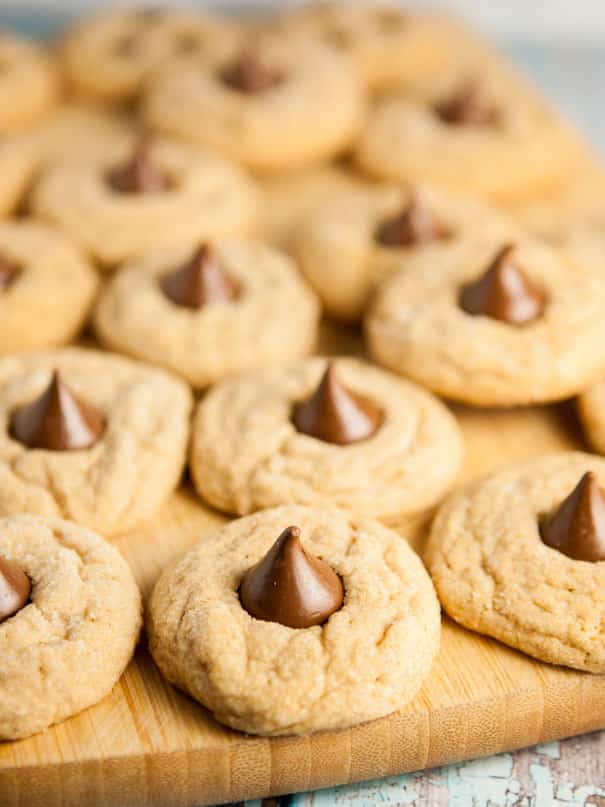Easy to make Peanut Butter Blossoms cookies.  The classic cookies are chewy with a chocolate Hershey kiss in the middle.  One of my favorite homemade Christmas cookies to bake!