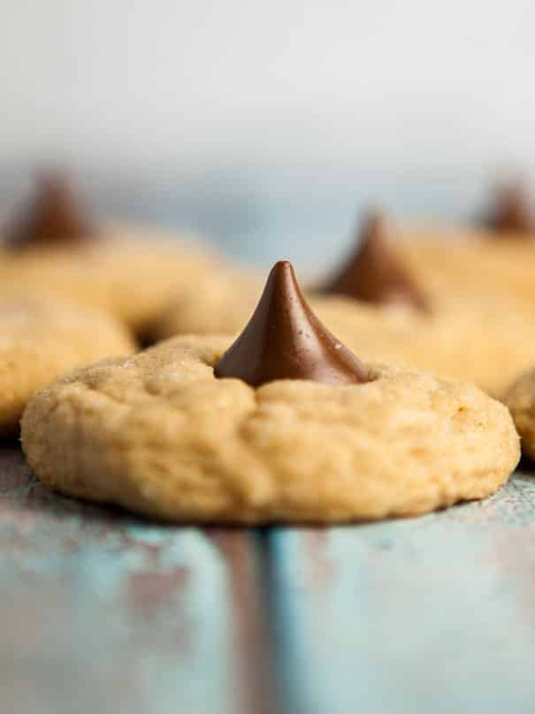 Easy to make Peanut Butter Blossoms cookies.  The classic cookies are chewy with a chocolate Hershey kiss in the middle.  One of my favorite homemade Christmas cookies to bake!