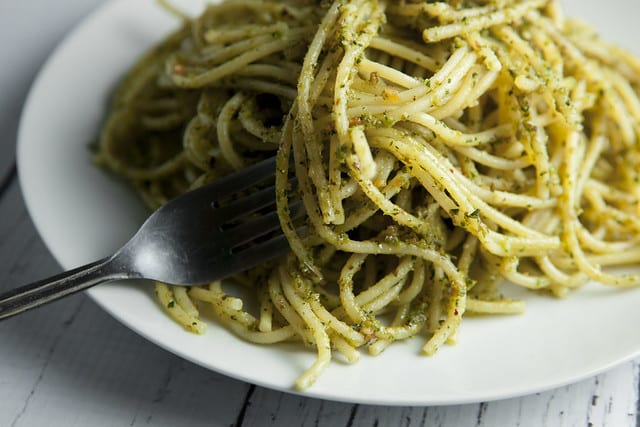 BUDGET FRIENDLY Basil Pesto Pasta recipe made with fresh basil and almonds! This easy, healthy homemade recipe makes delicious basil pesto that can be served over pasta, as appetizers or on a sandwich! Pine nuts are expensive so this is a much more budget friendly pesto.