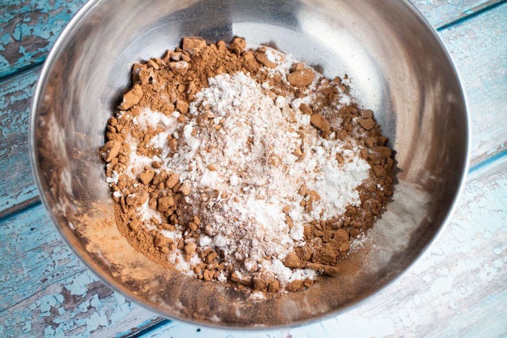 dry ingredients for donuts in metal bowl.