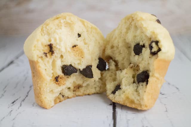 FLUFFY and EASY to make Chocolate Chip Muffins! This homemade recipe is my family's favorite! It makes delicious, moist muffins that are filled with chocolate chips! Make these light tasting yummy muffins for breakfast, snacks on the go or dessert!