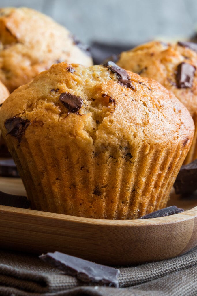side view of fluffy chocolate chip muffins.