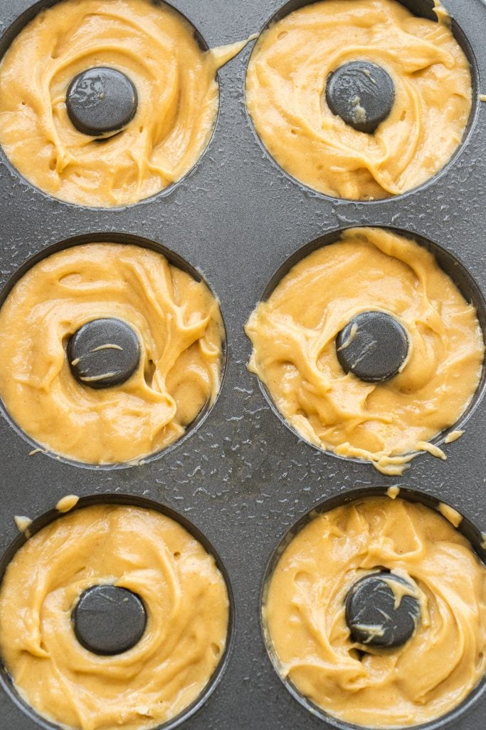 donut pan filled with donut batter.