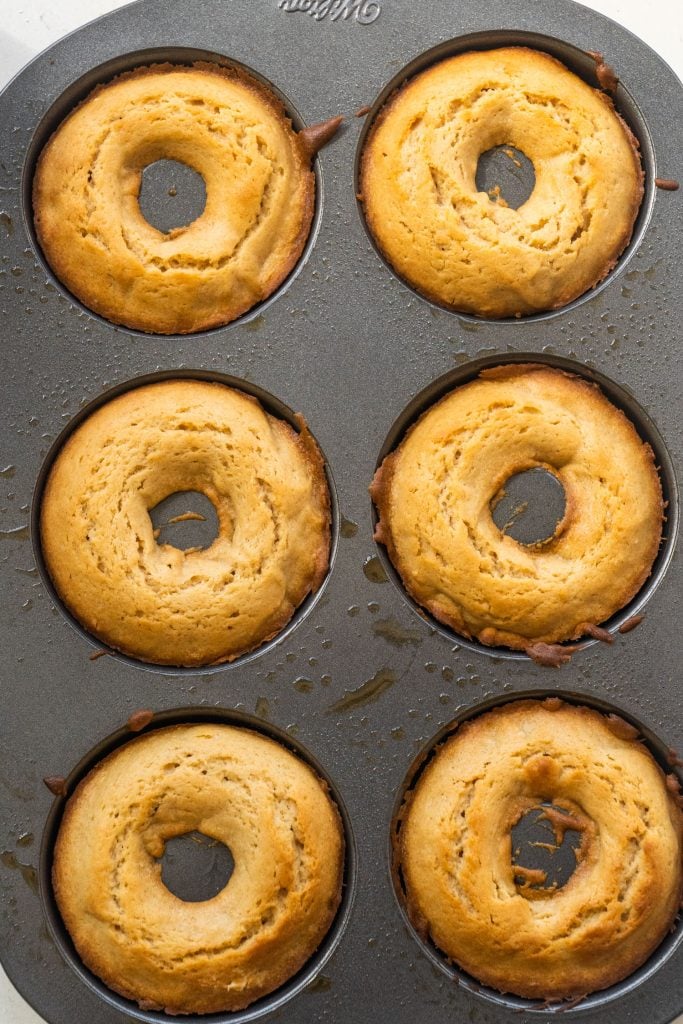 donut pan filled with baked donuts.