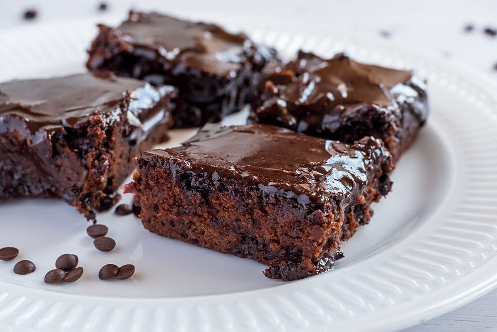 This Fudgy KIDNEY BEAN Brownies recipe is the BEST! These brownies are easy to make, moist and made with red beans to make them more healthy! They have a thick chocolate frosting on top that everyone will love! This is a sneaky way to get your kids to eat more vegetables! Trust me, everyone will think they're the best brownies ever!