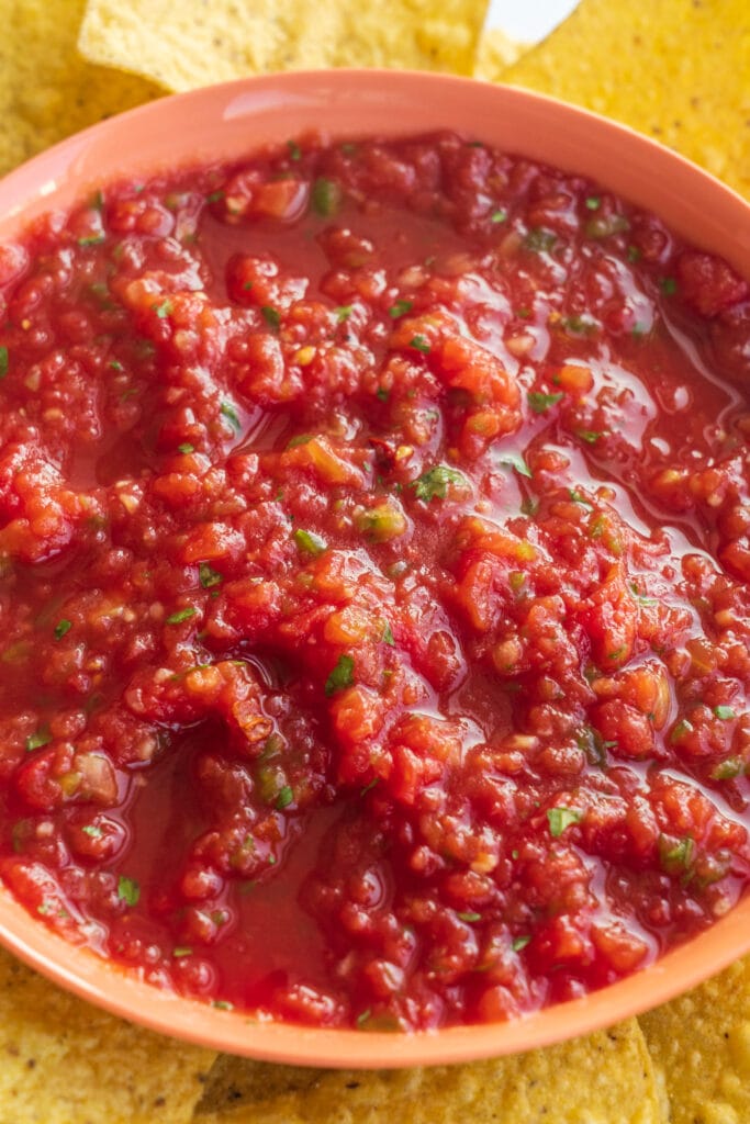 closeup of chunky salsa in orange bowl. 