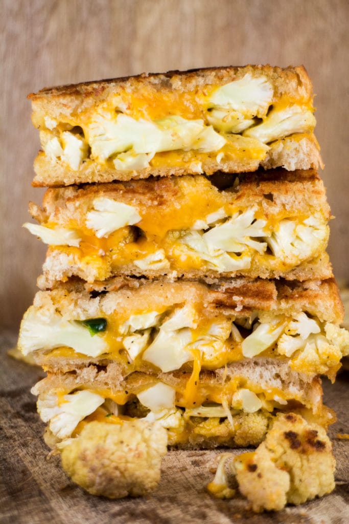 Easy, delicious Cauliflower Grilled Cheese Sandwich ready in 15 minutes.  It's a classic sandwich but looks fancy with roasted cauliflower and jalapeno peppers. 