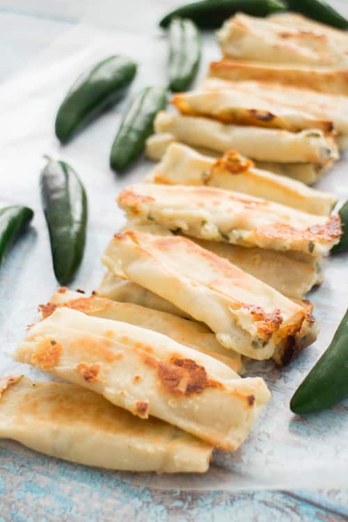 CHESSY JALAPENO WONTON POPPERS are so easy to make with wonton wrappers! This simple recipe uses cream cheese and jalapenos to wrap up in wonton wrappers! Bake them in the oven and serve them as a healthy appetizer! Everyone always LOVES these baked snacks!