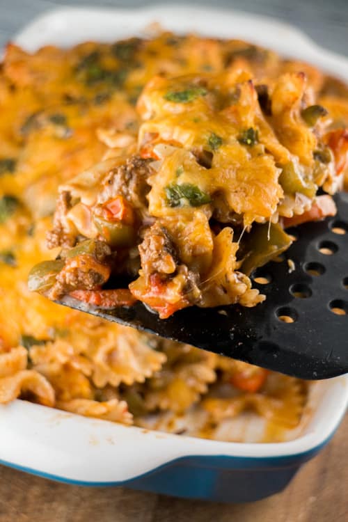 Cheesy Taco Casserole is a easy to make, comfort food recipe. Perfect for Taco Tuesday recipes! It has plenty of fresh vegetables (green pepper, tomatoes, jalapeno peppers), along with tomato soup that is going to hold those noodles together and soak up the good stuff.