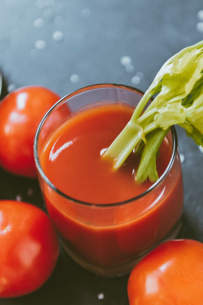 tomato juice with celery stick in it.