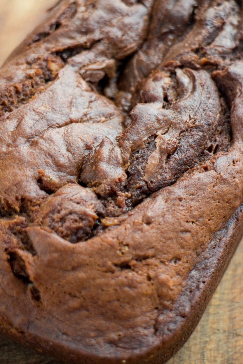 Nutella Swirled Banana Coconut Bread. One of the most delicious banana bread recipes that has creamy chocolate inside of it!