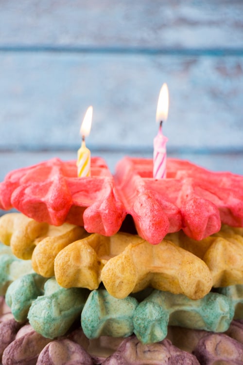 Big FLUFFY Belgian Rainbow Waffles are easy to make, taste delicious and will make any celebration even more special! This rainbow waffle recipe is the perfect birthday breakfast in bed and a good one to serve up on St. Patrick’s Day (or any day)!