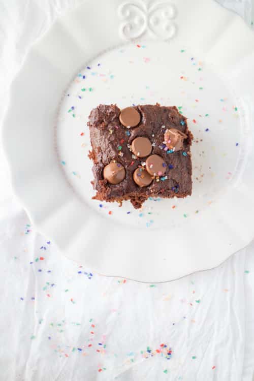 HEALTHY TRIPLE Chocolate Brownies that are low calorie because they're made with applesauce and egg whites!  This easy recipe makes super moist chocolate brownies, perfect for chocolate cake lovers!   Make sure to add rainbow sprinkles on top! 