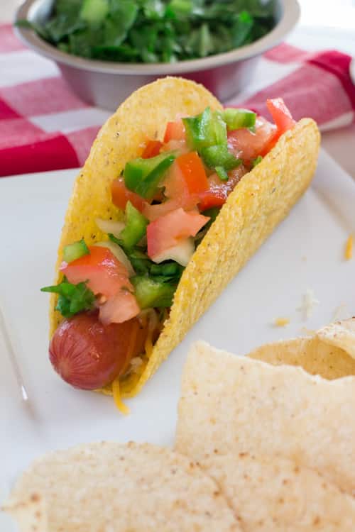 Mexican Taco Salsa Hot Dog recipe. This hot dog, taco combination is super tasty! It's perfect for Summer grilling too!