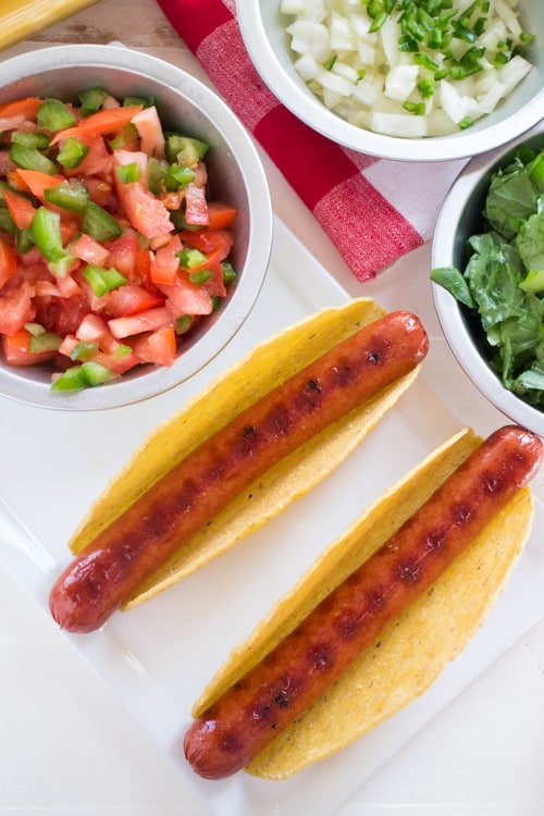 Mexican Taco Salsa Hot Dog recipe. This hot dog, taco combination is super tasty! It's perfect for Summer grilling too!