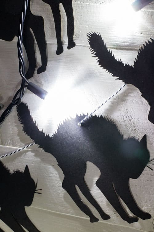DIY on how to make black cat Halloween garland. Super easy to make with a laser cutter. All you need is paper and string!