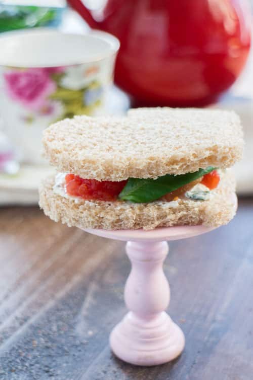 EASY Ricotta and Tomato Tea Sandwiches made with tomatoes and an easy homemade ricotta garlic mixture that tastes amazing! Use cookie cutters to cut out hearts in your bread – perfect for an afternoon tea party, baby shower or for Valentine's Day. 