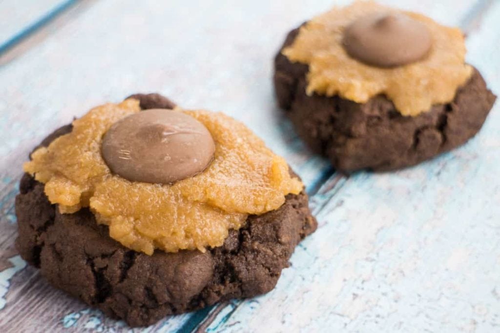 Scrumptious Chocolate Cookies With DA BOMB Peanut Butter Frosting. The most popular cookie that friends and families ask me to make! Recipe makes 2 dozen cookies.