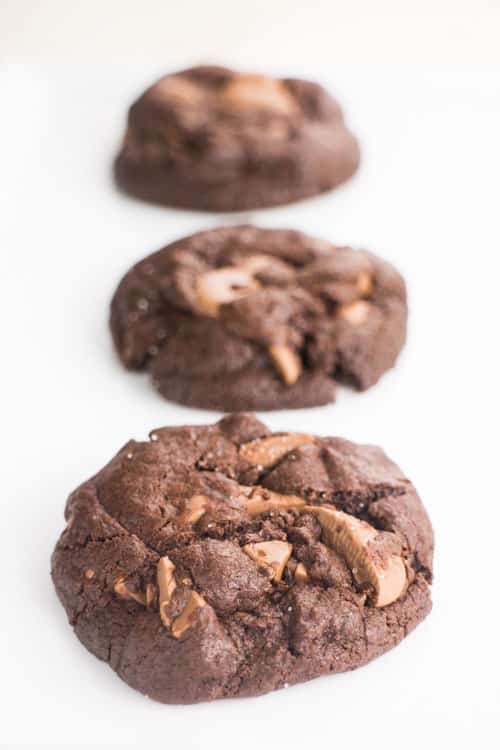  Double Chocolate Chip Cookies are thick, chewy and loaded with chocolate! These cookies are made from scratch and you’ll love how EASY the recipe is! Live dangerously with these irresistible, softest chocolate chip cookies that have a dash of sea salt on top!  One of our favorite homemade cookies to make around the holidays or anytime. 