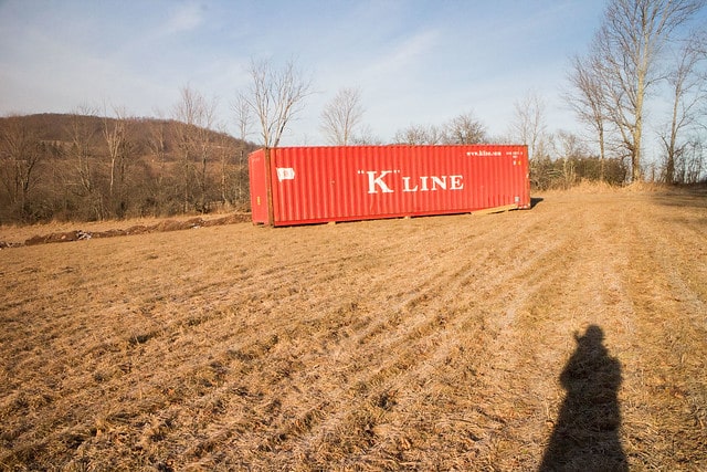 Delivery of our first shipping container to build our tiny house in Upstate New York!  This post shows pricing and how to get it delivered.