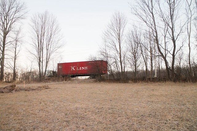 Delivery of our first shipping container to build our tiny house in Upstate New York!  This post shows pricing and how to get it delivered.