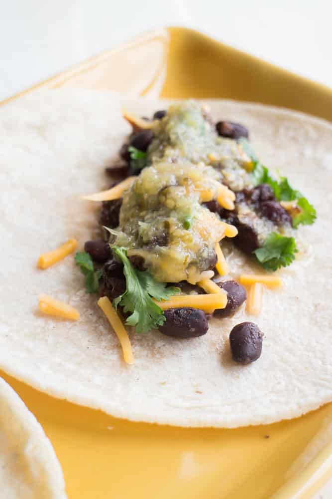 Slow Cooker Black Beans are slow cooked with spices for 4 hours. They make delicious tacos!