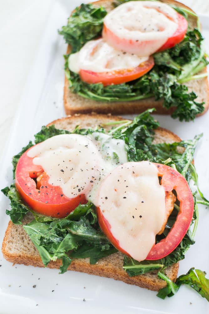 Healthy Kale Arugula Sandwich with Melted Cheese that is only 250 calories! This delicious open faced sandwich is perfect for lunch or a meatless dinner. 
