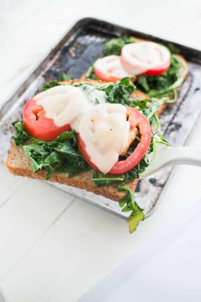 Healthy Kale Arugula Sandwich with Melted Cheese that is only 250 calories! This delicious open faced sandwich is perfect for lunch or a meatless dinner. 