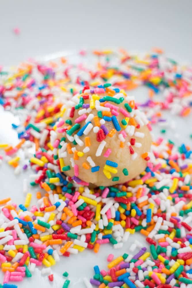 Sprinkled Butter Cookies are delicious! Roll them around in colored sprinkles to make them more festive. This recipe uses evaporated milk to make the cookies extra soft! Recipe makes 2 dozen cookies.
